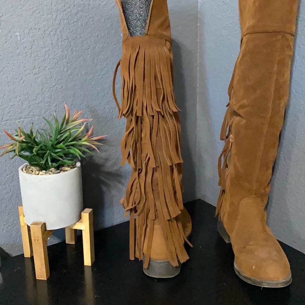 Knee high fringe boots
